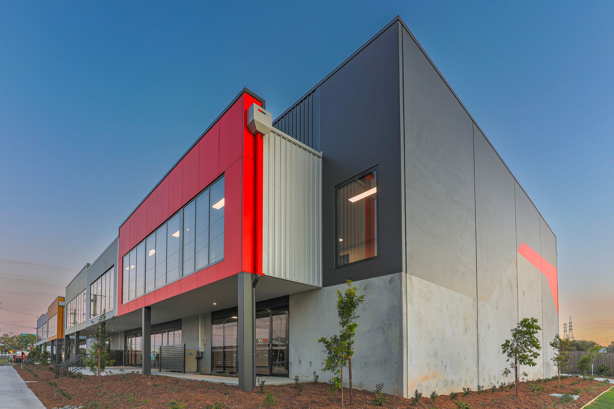 Modern commercial building frontage with new landscaping
