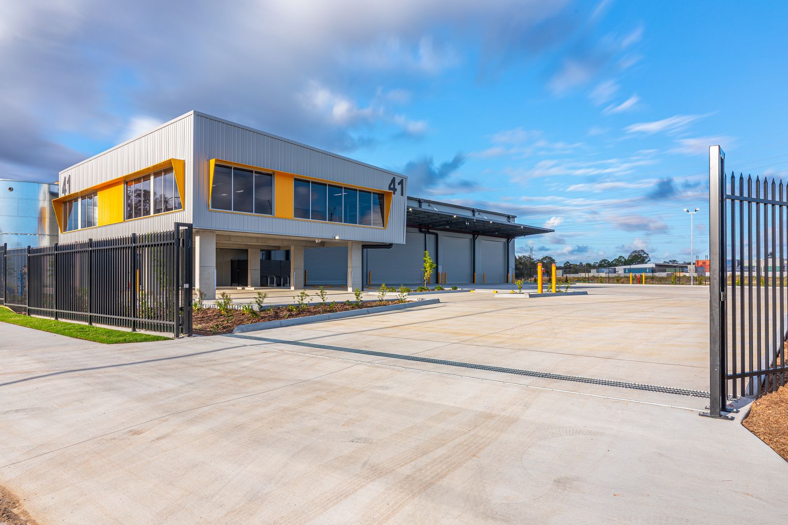 Commercial warehouse with landscaped frontage and car park